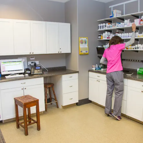 Medication room with staff member working